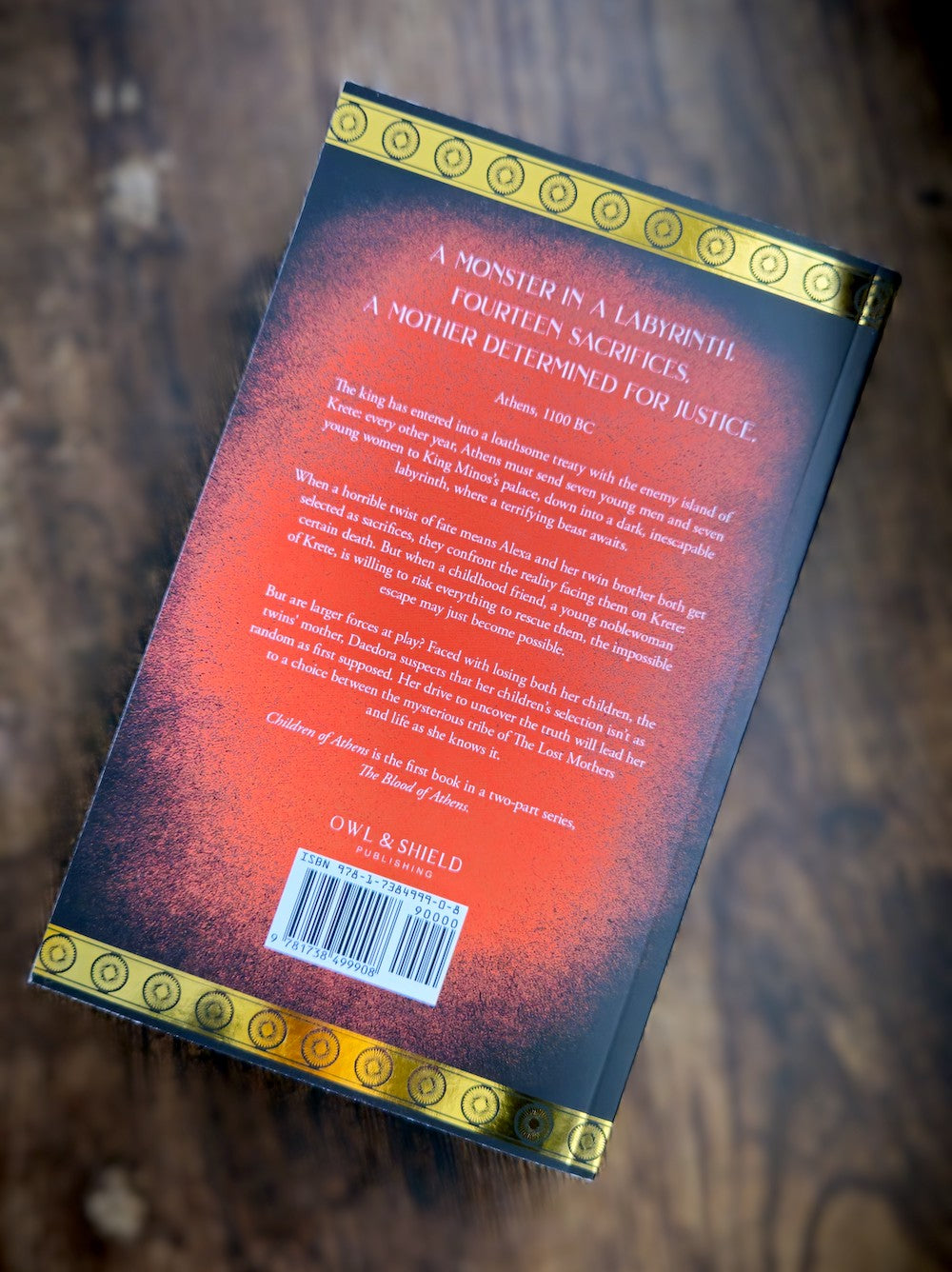 Paperback back cover of 'Children of Athens' by K. J. Verma with blurb